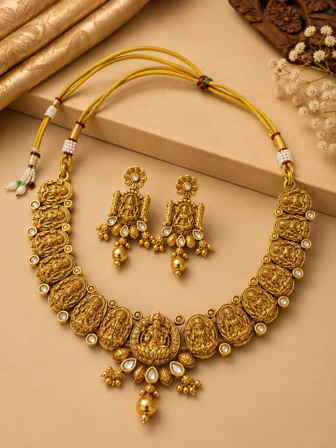 Antique gold Lakshmi temple jewellery set with necklace and matching statement earrings