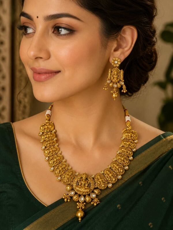 Woman wearing Aaradhya Lakshmi Temple Necklace Set with dark green saree